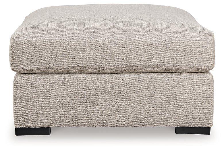 Ashley Furniture Ballyton oversized accent ottoman with plush fabric and sturdy wooden legs, ideal for living room decor.