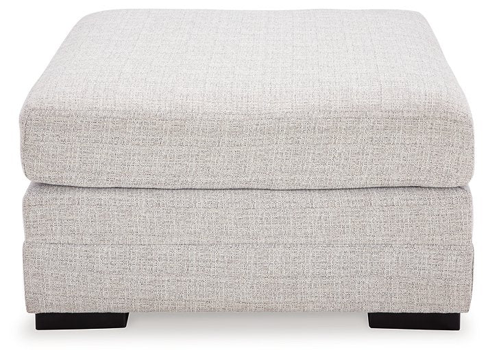 Ashley Furniture Koralynn oversized accent ottoman with fabric upholstery and plush cushioning, shown from a front head-on view.