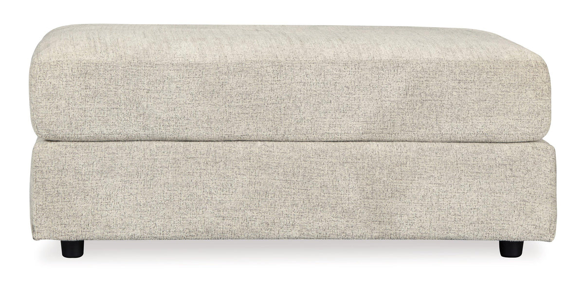 Oversized Ashley Furniture Soletren Ottoman with plush fabric and modern design, placed in a stylish living room setting.