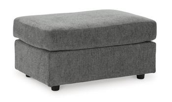 Ashley Furniture Stairatt Ottoman in neutral fabric, showcasing its plush, versatile design suitable for living room or bedroom decor.