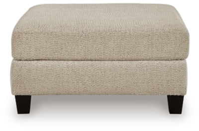 Ashley Furniture Steelwater Retreat oversized accent ottoman with plush fabric and modern design, shown from a front head-on view.
