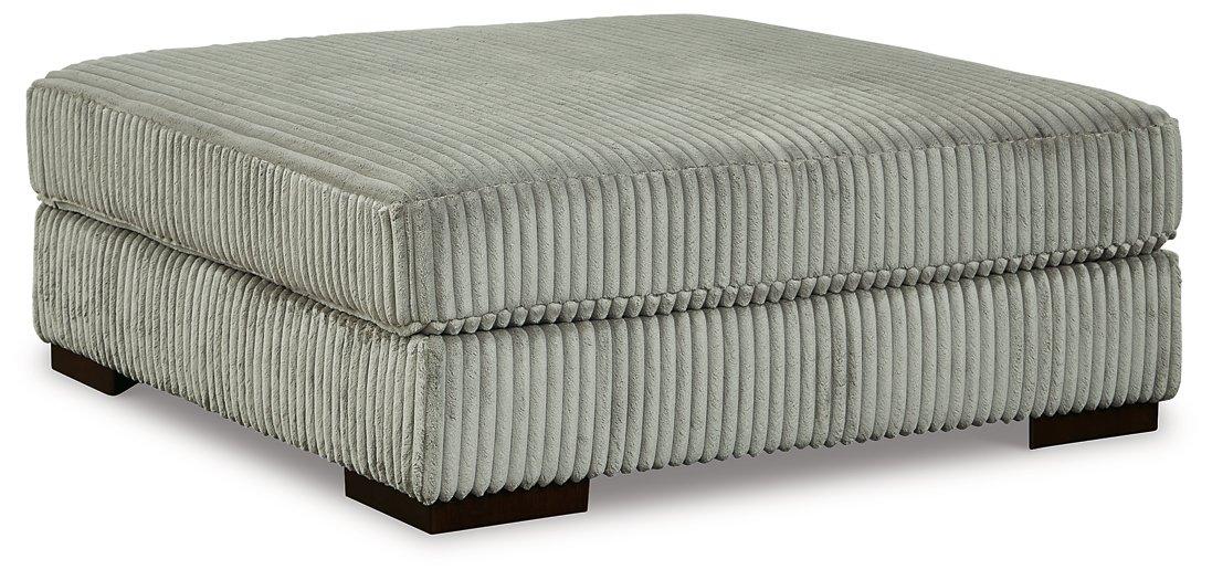 Lindyn oversized accent ottoman by Ashley Furniture with plush fabric and a modern design, perfect for living room decor.