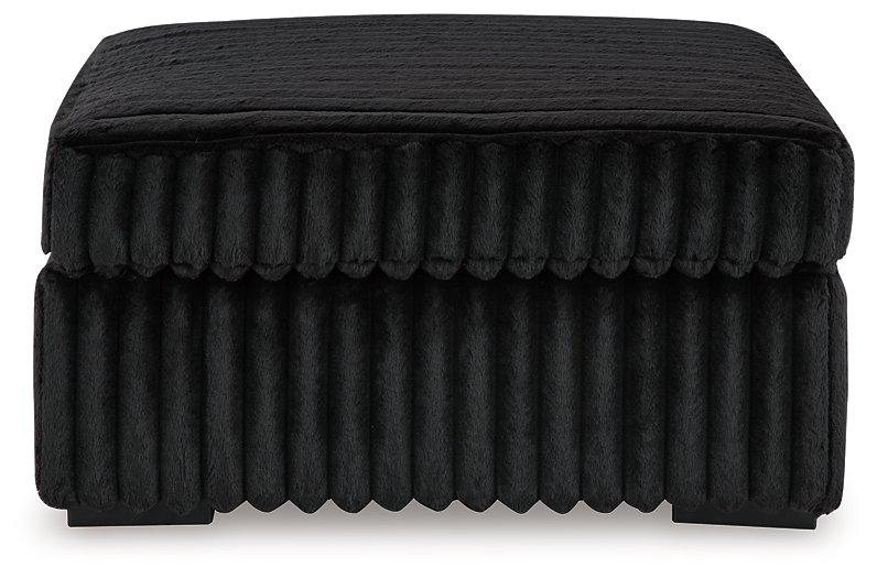 Oversized Ashley Furniture Midnight-Madness accent ottoman with plush fabric and modern design, perfect as a stylish living room piece.