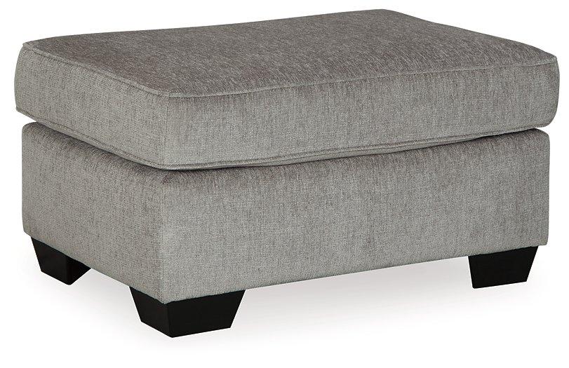 Ashley Furniture Altari Ottoman featuring a plush fabric top and wooden legs, designed for versatile living room seating.