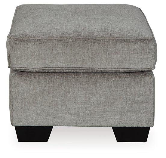 Ashley Furniture Altari Ottoman, plush fabric with tufted design, rectangular shape, used as a versatile living room accent piece.