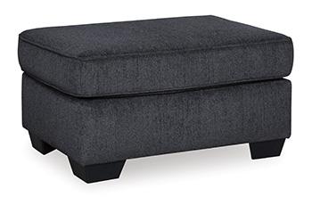 Ashley Furniture Altari Ottoman in neutral fabric with wooden legs, showcasing its compact design and versatile style.