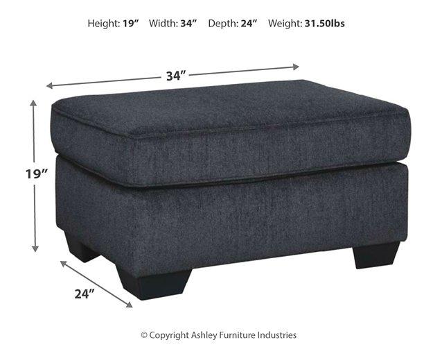 Ashley Furniture Altari Ottoman showing a plush fabric surface and wooden legs, versatile piece for living room decor.