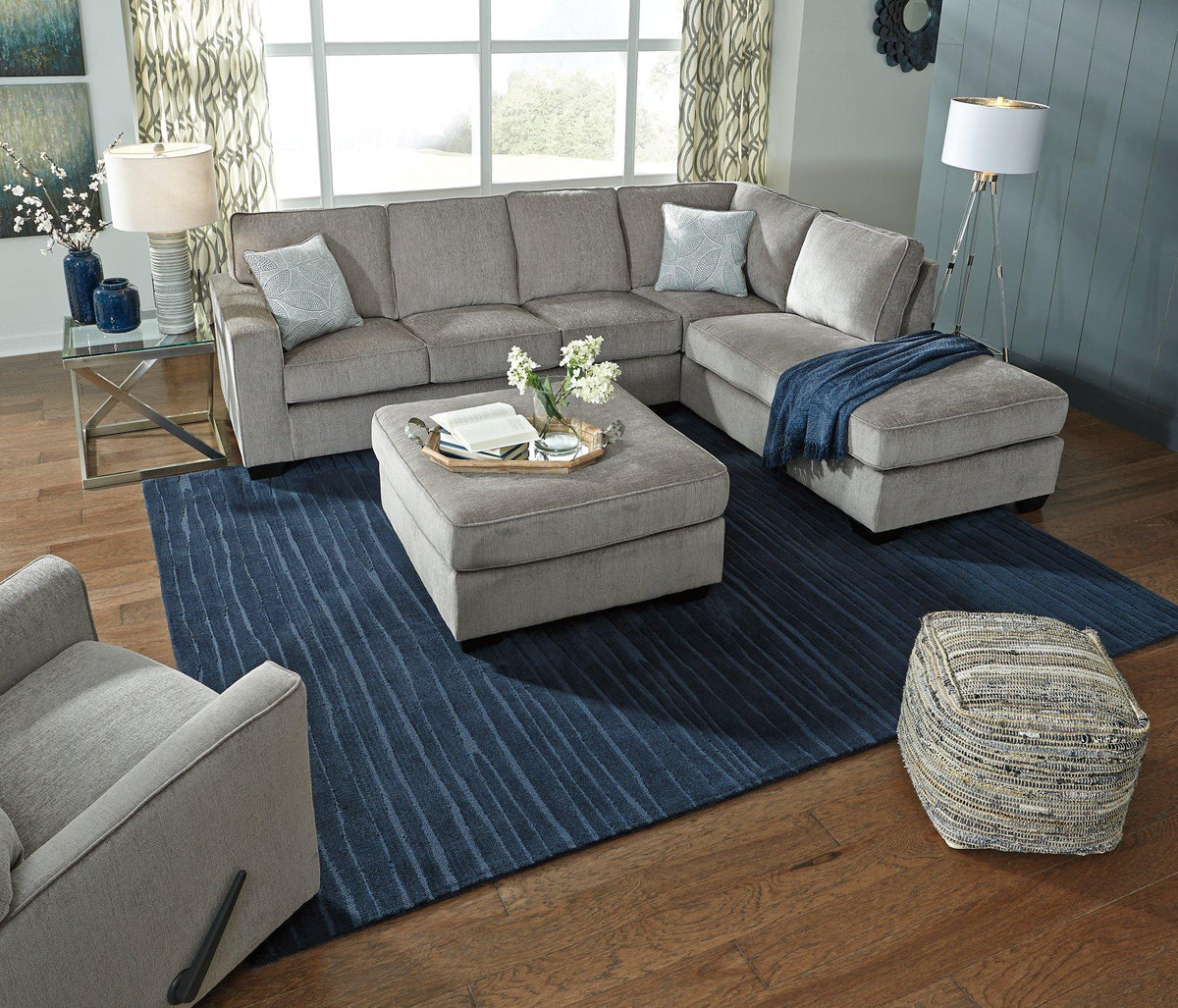 Oversized Ashley Furniture Altari accent ottoman with plush fabric, featuring a modern design and sturdy wooden legs.