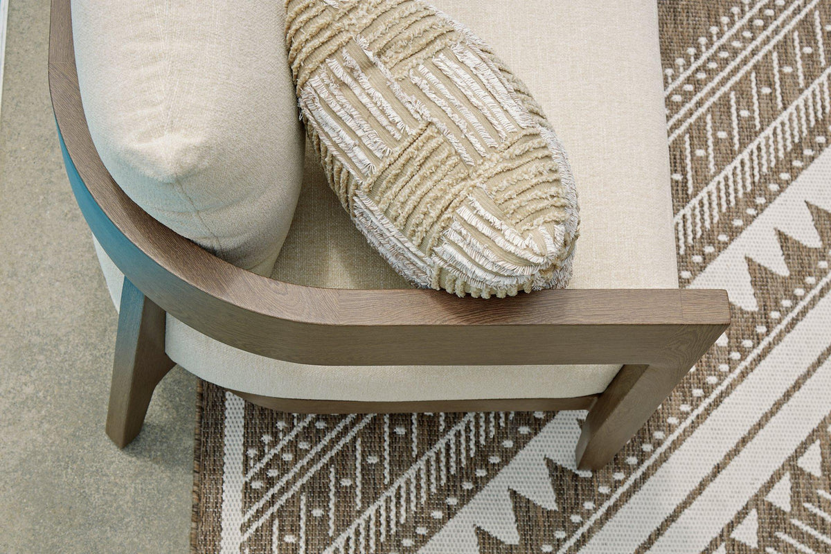 Ashley Furniture Serene Bay outdoor loveseat with cushioned seating and armrests, perfect for patio relaxation.