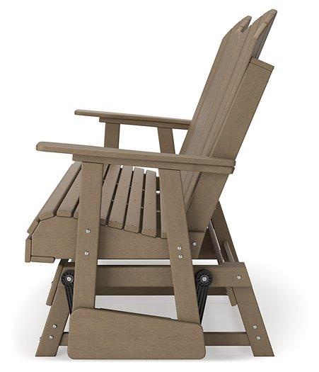 Outdoor loveseat by Ashley Furniture, Hyland Wave Glider Loveseat, featuring cushioned seating and a stylish outdoor design.