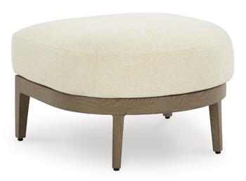 Outdoor ottoman with cushion from Ashley Furniture, featuring a woven design and sturdy frame for stylish outdoor seating.