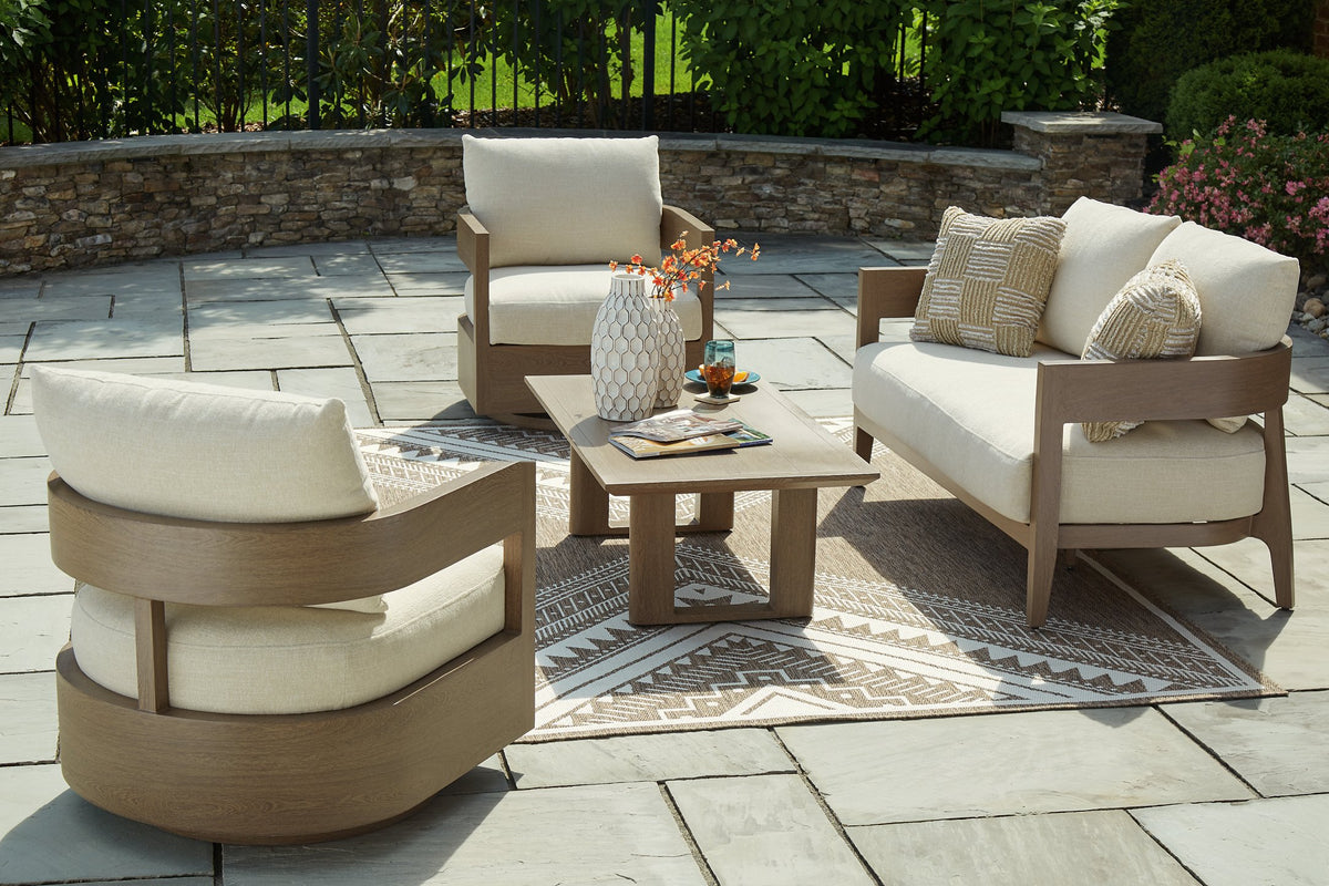 Ashley Furniture Serene Bay outdoor seating set with cushioned chairs and glass-top table in a patio setting.