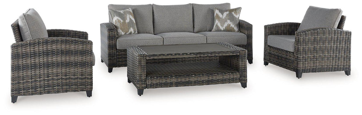 Outdoor seating set by Ashley Furniture with sofa, chairs, and table, featuring modern design for patio or garden use.