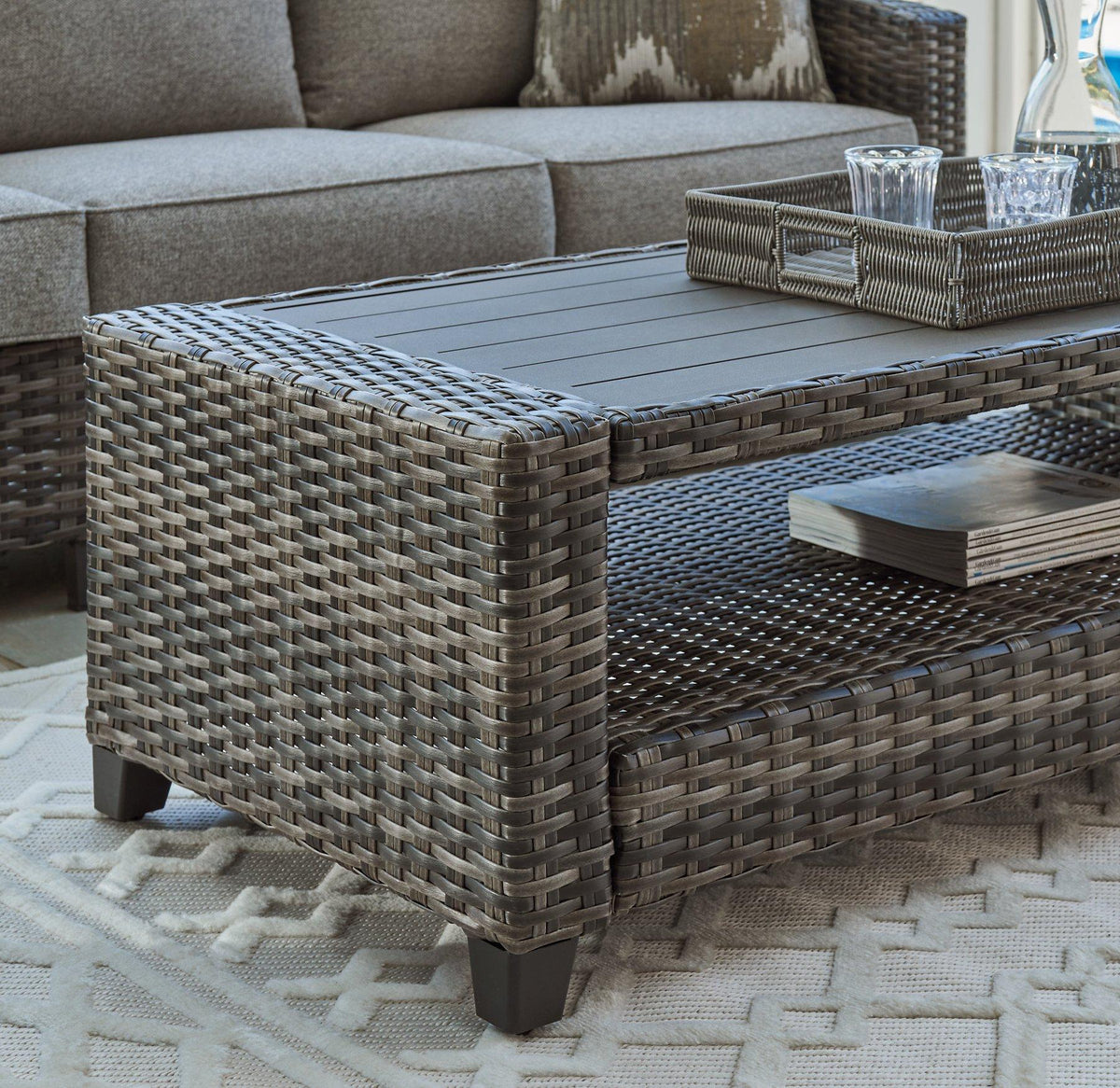Ashley Furniture Oasis Court outdoor seating set with sofa, chairs, and table for patio or garden, weather-resistant design