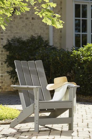 Outdoor Adirondack chair and end table set by Ashley Furniture, featuring weather-resistant wood and comfortable seating for outdoor spaces.