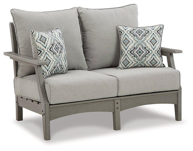 Outdoor loveseat and chair set from Ashley Furniture's Visola outdoor seating collection, with cushions and weather-resistant design.