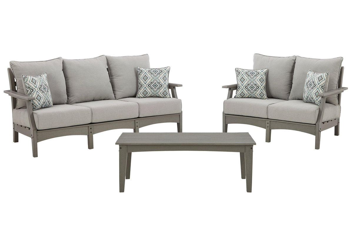 Ashley Furniture outdoor seating set featuring a sofa, loveseat, and coffee table with weather-resistant cushions and stylish design.