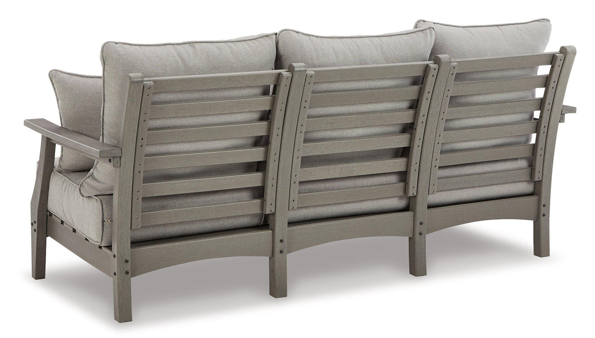 Outdoor seating set with sofa, loveseat, and coffee table by Ashley Furniture, featuring cushioned seats and a modern design.