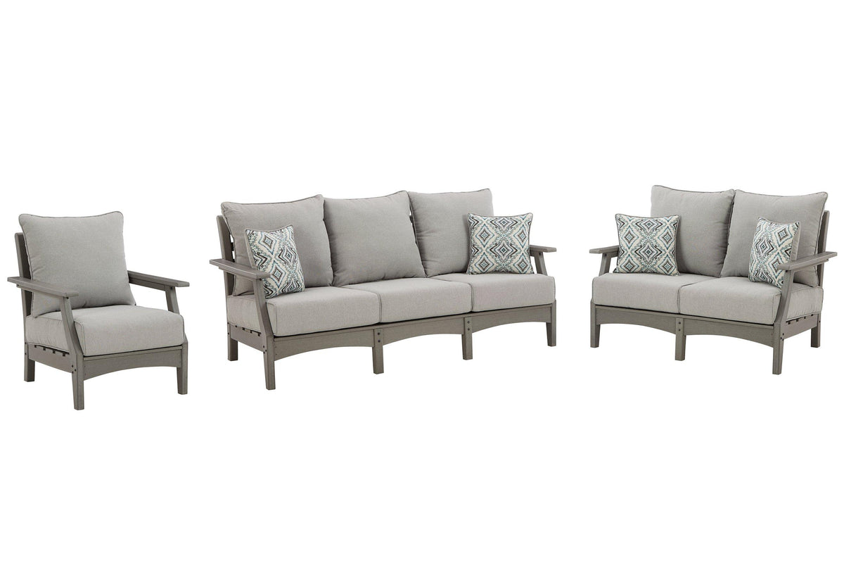 Outdoor Ashley Furniture Visola outdoor seating set with cushioned chairs and table, ideal for patio relaxation and outdoor gatherings.