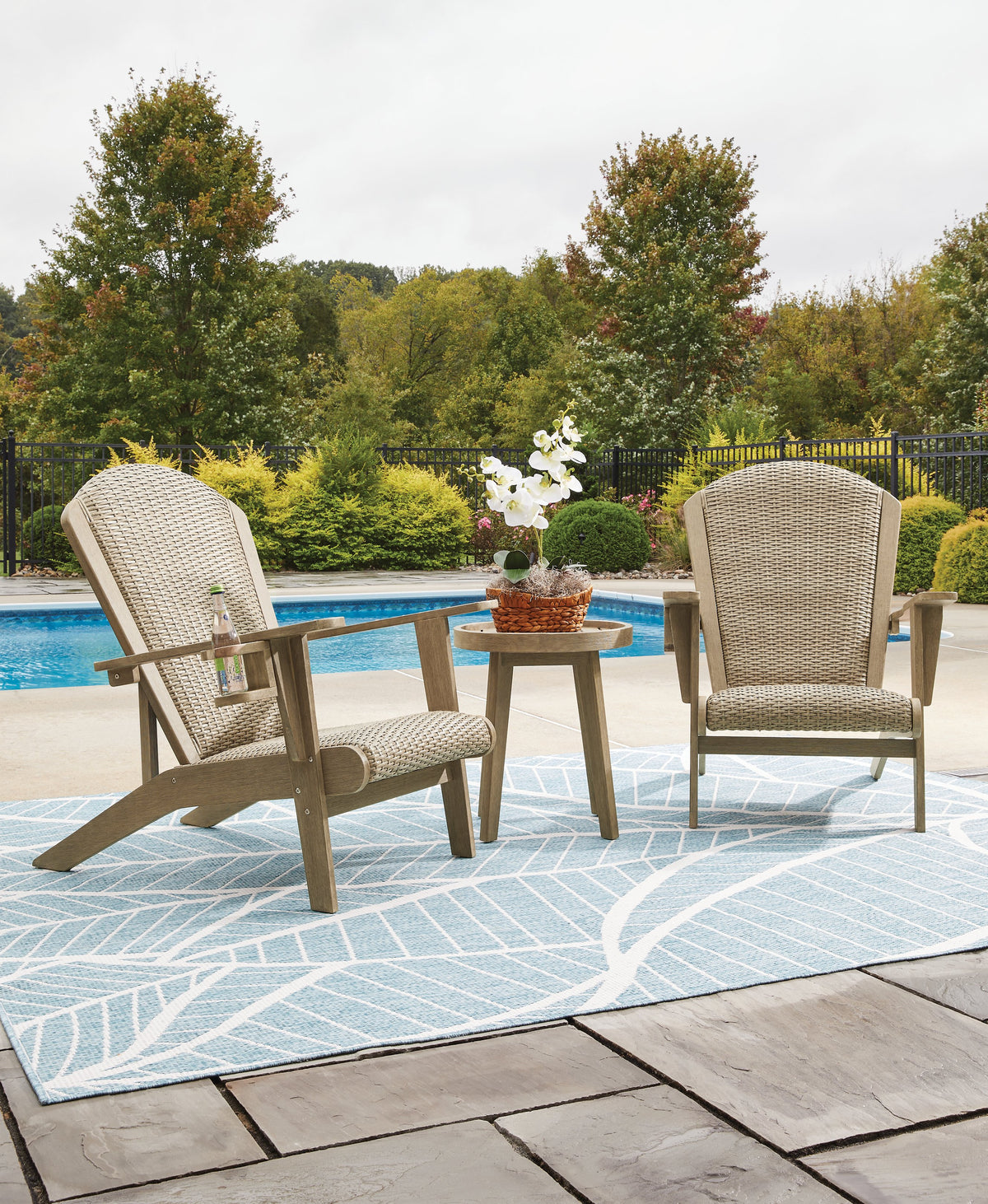 Ashley Furniture Marina Sun outdoor table set with a spacious table and matching chairs, perfect for outdoor dining and entertaining.