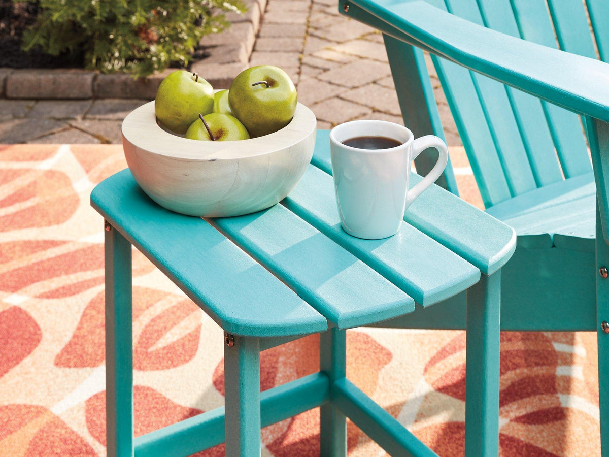 Outdoor table set from Ashley Furniture featuring a glass-top table and cushioned chairs in a stylish outdoor seating arrangement.