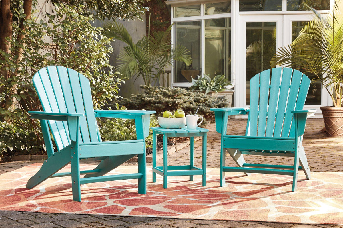 Outdoor table set from Ashley Furniture featuring a spacious table and matching chairs in a garden setting.