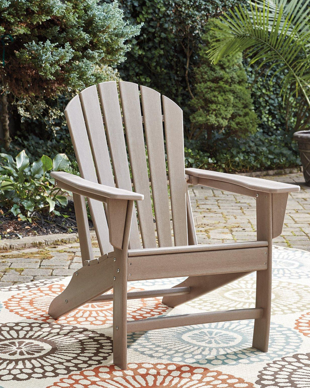 Outdoor table set from Ashley Furniture with a glass-top table and cushioned chairs, part of the Sundown Treasure outdoor seating collection.