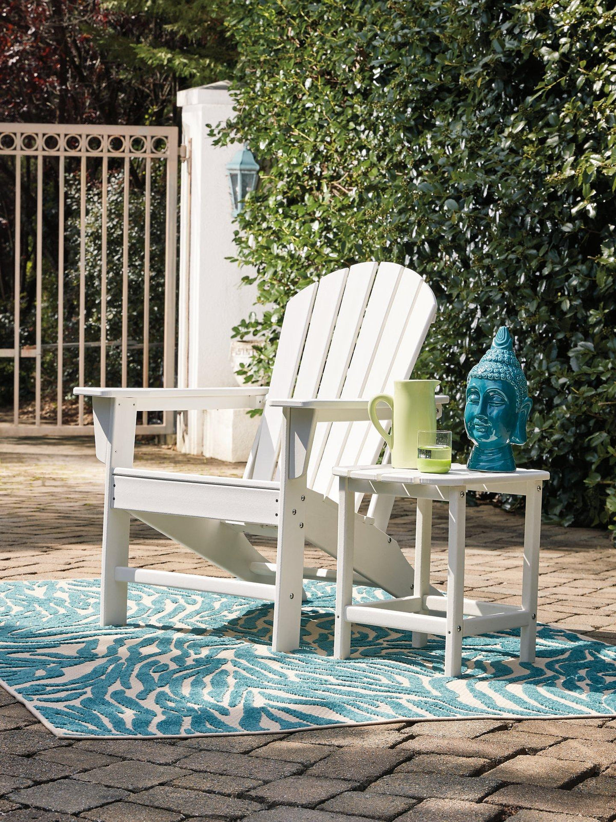 Outdoor table set from Ashley Furniture with a glass-top table and matching chairs, perfect for patio or backyard seating.