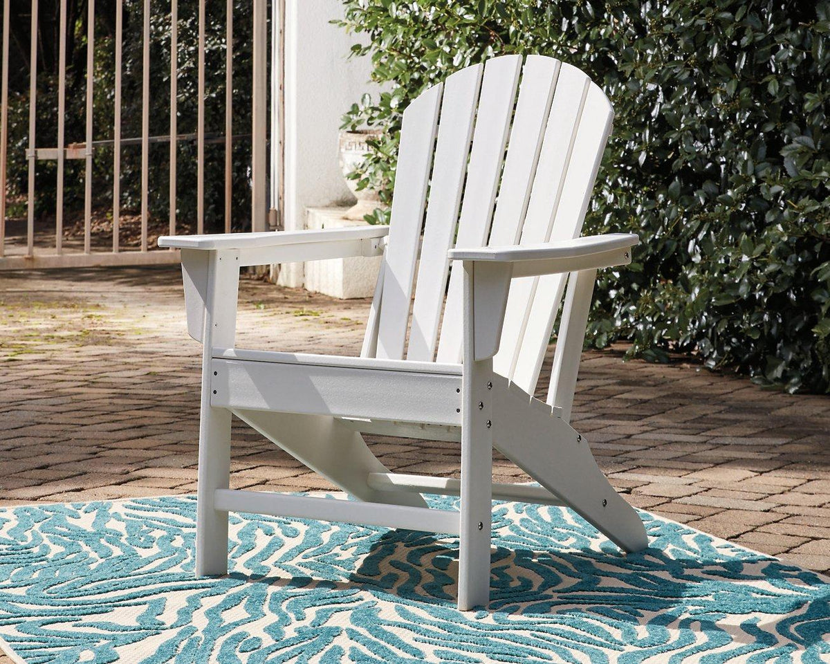 Outdoor table set with a wooden dining table and matching chairs from Ashley Furniture Sundown Treasure Outdoor Seating Set.