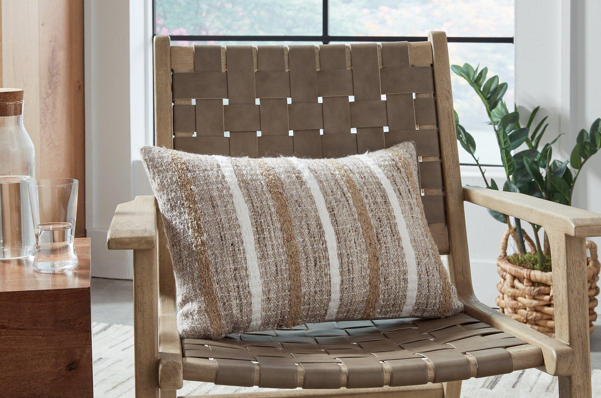 Set of four Ashley Furniture Benish pillows with soft fabric and decorative patterns, perfect for sofa or bed decor.