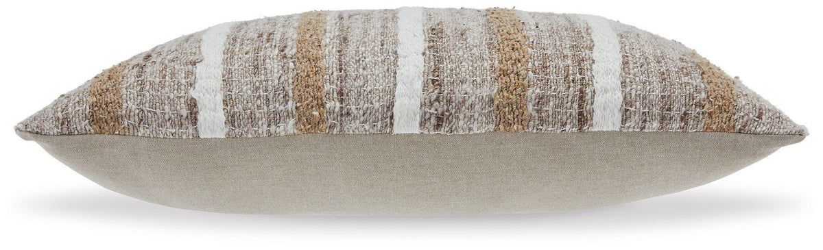 Set of four Ashley Furniture Benish pillows with soft fabric covers and decorative stitching, arranged on a neutral-colored sofa.