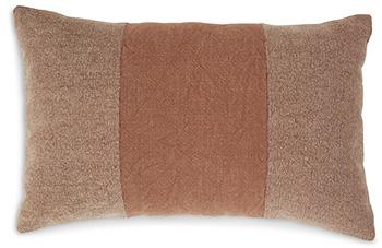 Set of four Ashley Furniture Dovinton pillows with textured fabric and neutral tones, displayed on a cozy sofa.