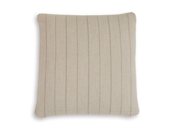 Set of four Ashley Furniture Valwick pillows with soft fabric covers, arranged on a cozy sofa for stylish comfort.