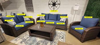 Ashley Furniture Windglow Pillow with decorative fabric and plush filling, perfect for adding comfort and style to a living space.