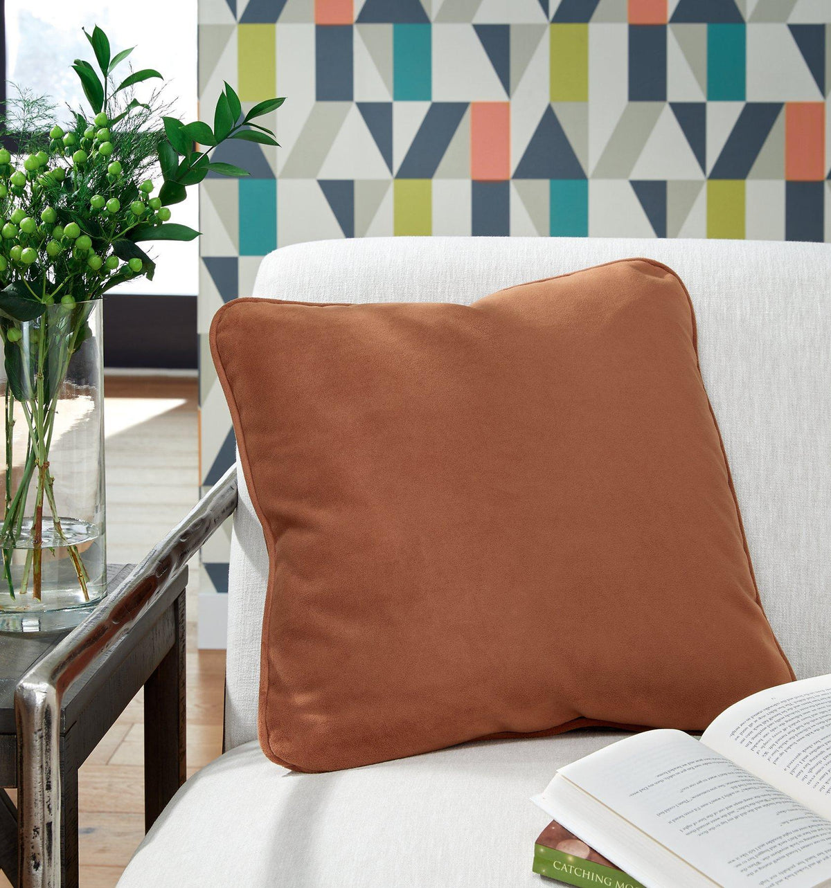 Ashley Furniture Caygan Pillow with textured fabric and plush design, perfect for decorative or comfort use in living spaces.