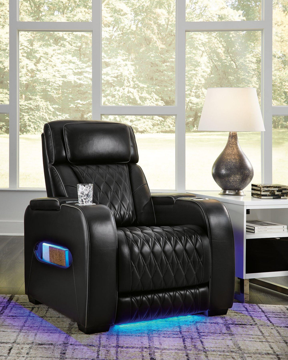 Boyington Power Recliner by Ashley Furniture, showing a comfortable gray recliner with padded armrests and plush cushioning.
