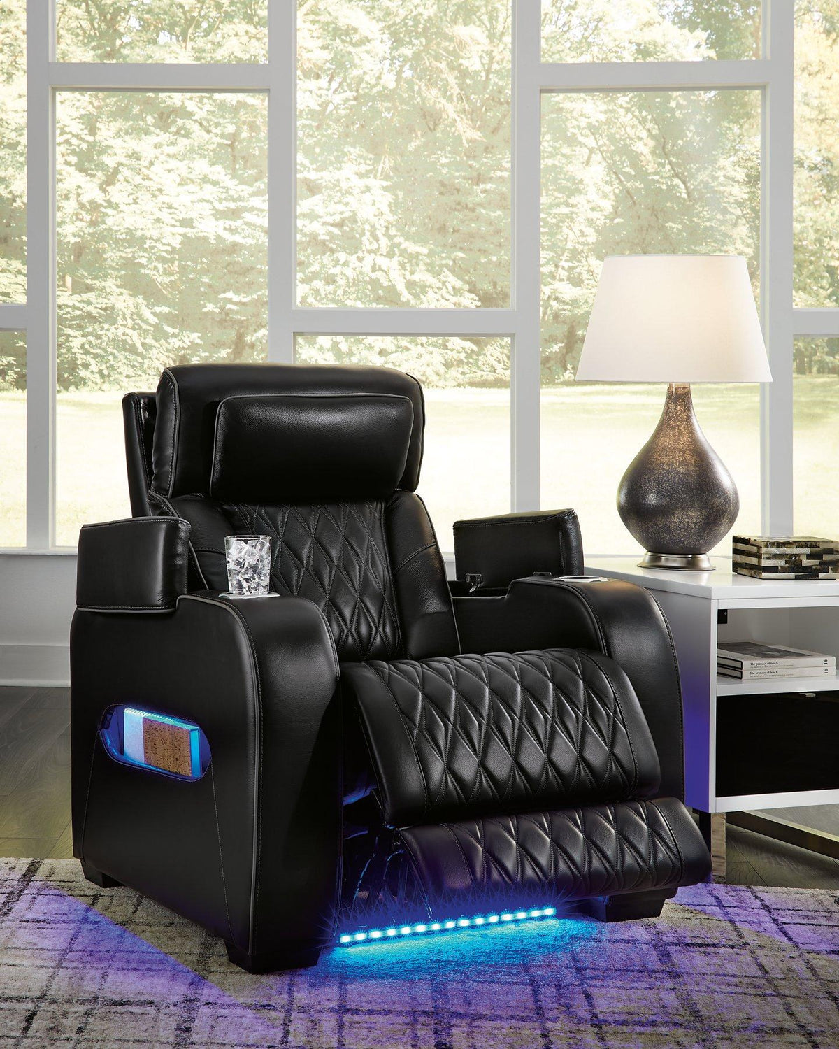 Boyington power recliner by Ashley Furniture, showing plush cushioned seat and armrests in a modern recliner design.