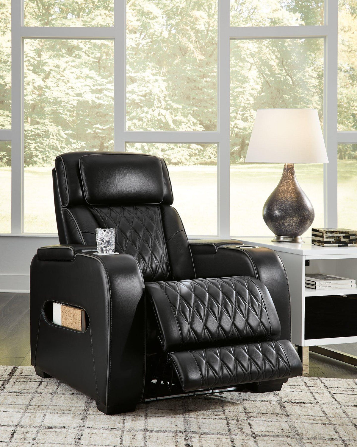 Boyington Power Recliner by Ashley Furniture, showing a comfortable leather recliner with plush cushioning and a modern design.