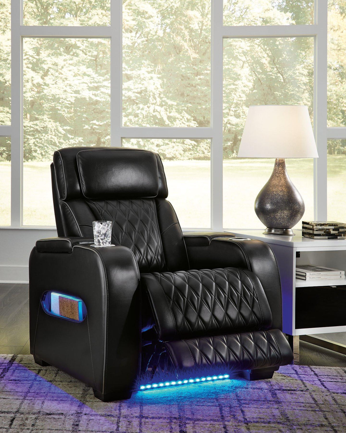 Ashley Boyington Power Recliner in dark gray fabric with plush cushioning and built-in recline mechanism, perfect for relaxing.