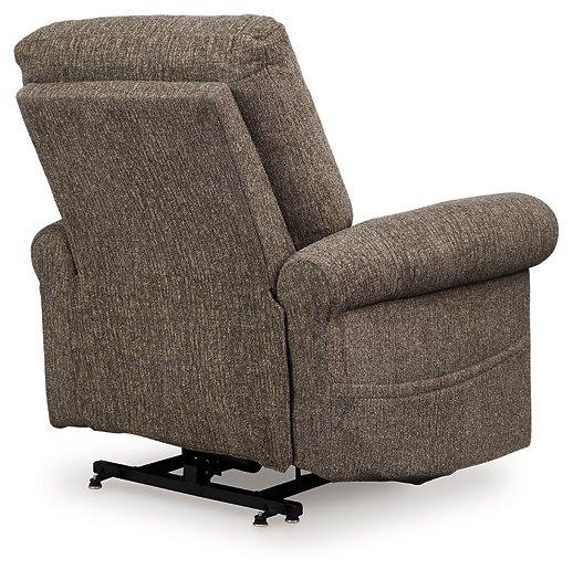 Ashley Furniture Aureta Power Lift Recliner in beige fabric with plush cushioning and a built-in lift mechanism.