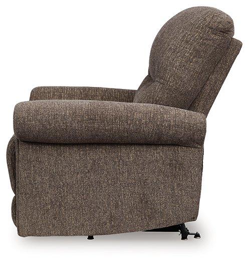 Ashley Furniture Aureta Power Lift Recliner in beige fabric with plush cushioning and a built-in remote for easy adjustment.