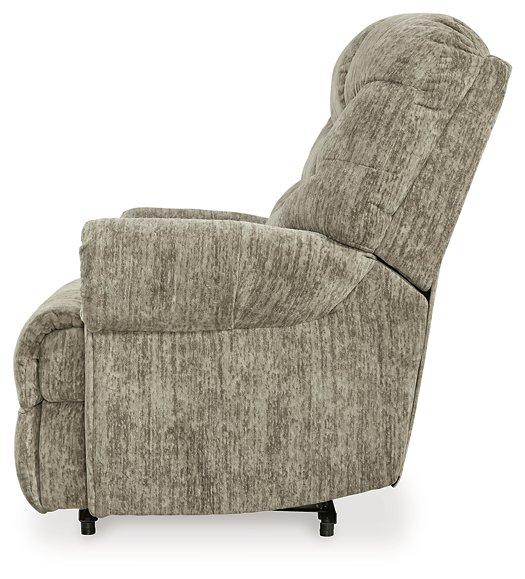 Comfortable Movie Man recliner by Ashley Furniture, showcasing plush upholstery and a reclining mechanism for relaxed movie nights.