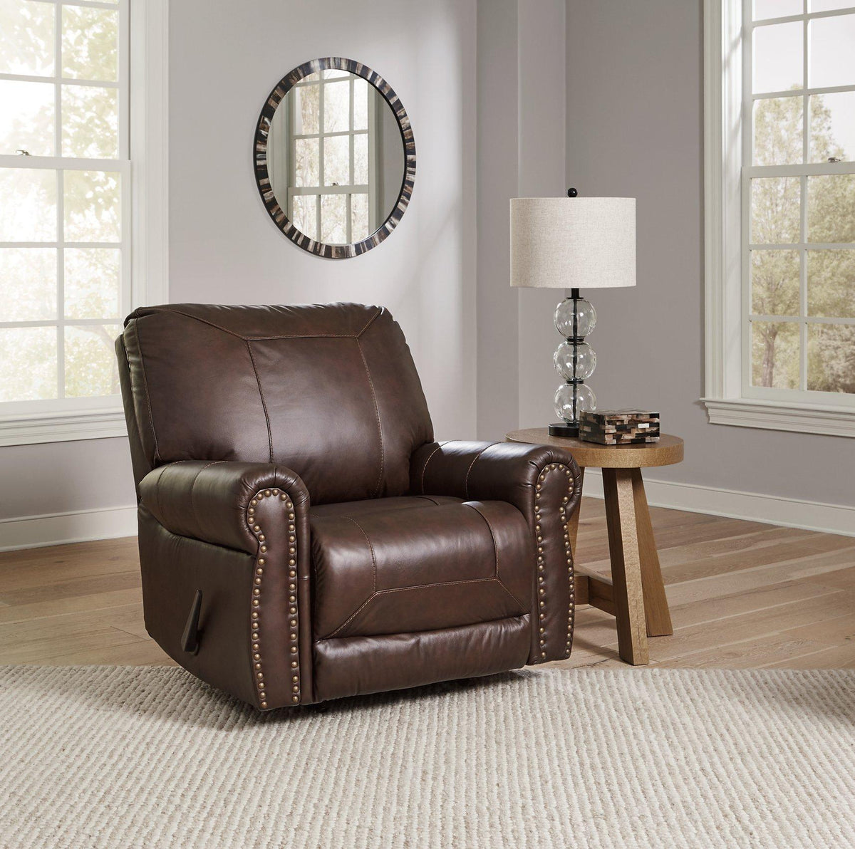 Comfortable Ashley Furniture Colleton recliner with plush upholstery and padded armrests, perfect for relaxing in any living room.