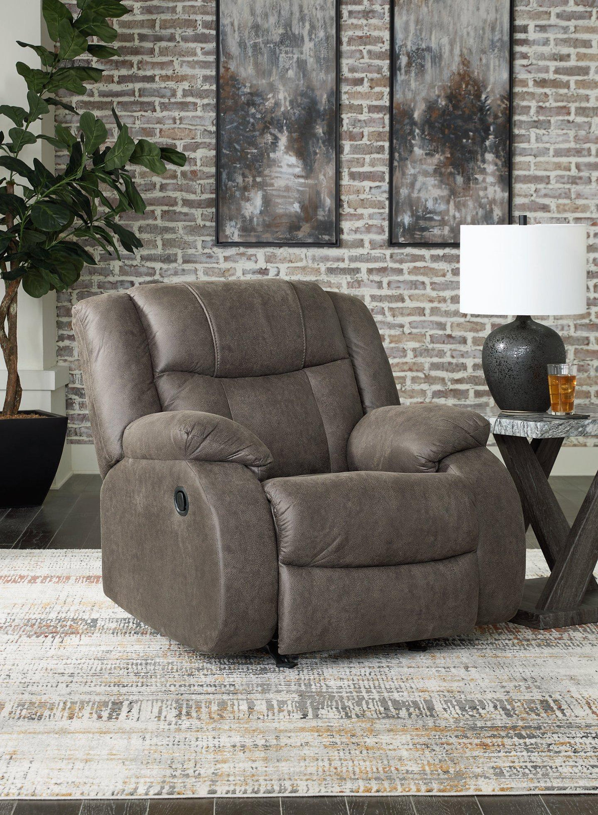 Comfortable Ashley Furniture First Base recliner with plush cushioning and a neutral fabric finish, perfect for relaxing in living rooms.