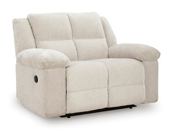 Ashley Furniture Orlen oversized recliner in dark brown fabric, showing a side view with plush cushions and wide armrests.