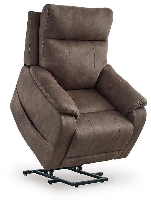 Ashley Furniture Crestmeade power lift recliner in plush fabric with padded armrests and a sturdy base for comfortable support.