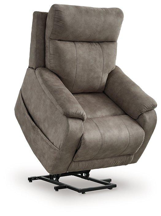 Ashley Furniture Crestmeade Power Lift Recliner showing plush upholstery and adjustable reclining features in a living room setting.