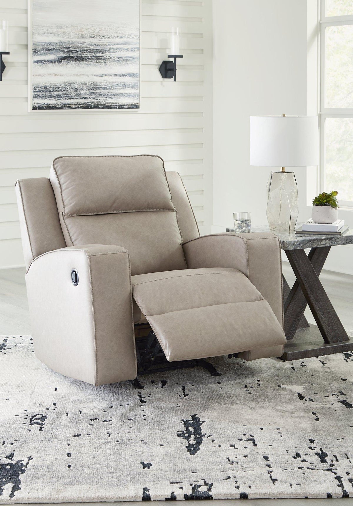 Lavenhorne recliner by Ashley Furniture with plush fabric, padded armrests, and a comfortable recline position.