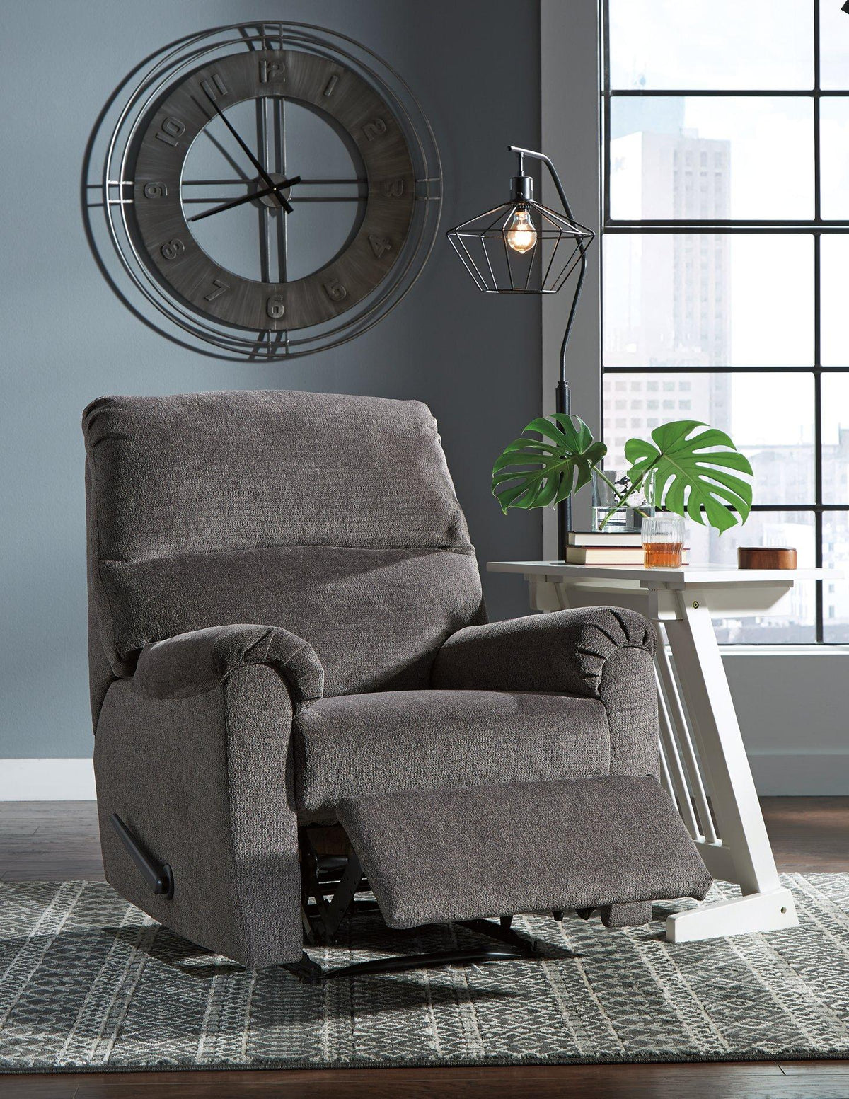 Nerviano recliner by Ashley Furniture featuring plush upholstery and padded armrests in a cozy living room setting