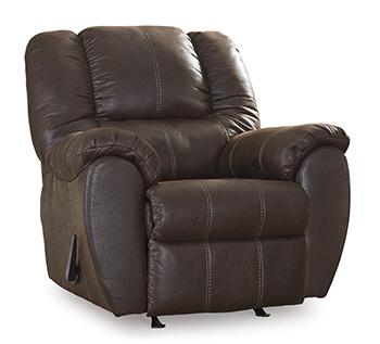 Ashley Furniture McGann recliner with plush upholstery and padded armrests, shown in a cozy living room setting.